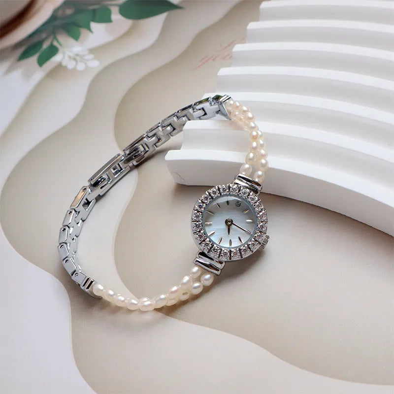 Women's light gold bracelet watch with freshwater pearls, 18mm round dial, stainless steel strap