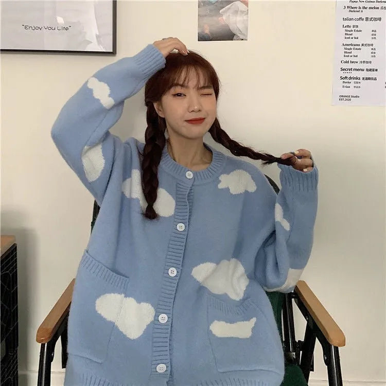 Blue loose-fit women's spandex cardigan sweater with a white cloud pattern.