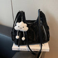 Women's soft PU fashion backpack in four colours with wear-resistant construction and included pendant accessory