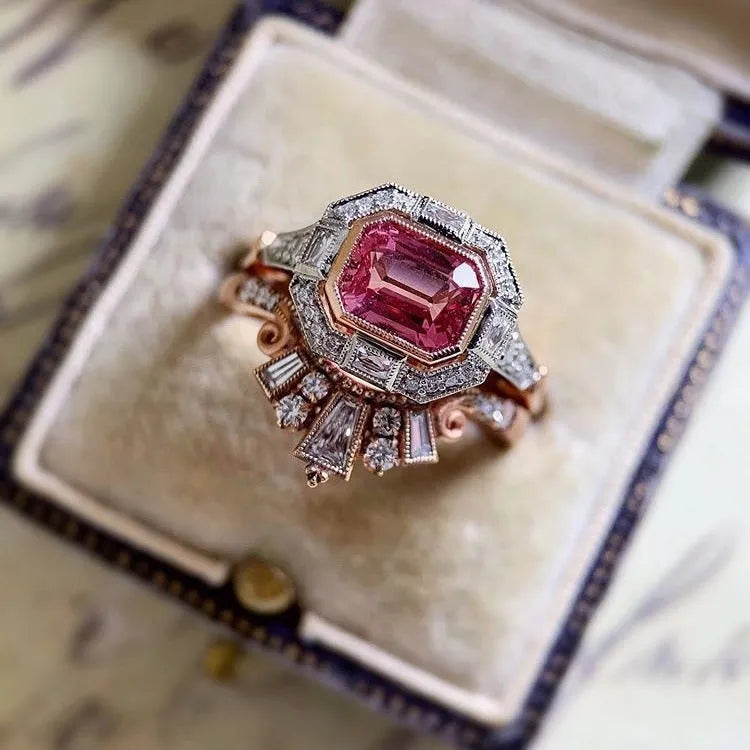 Rose gold alloy women's ring with geometric design and ruby accent, available in sizes 5 to 11.