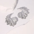 Stainless steel leaf earrings with electroplated finish in gold or steel colour options