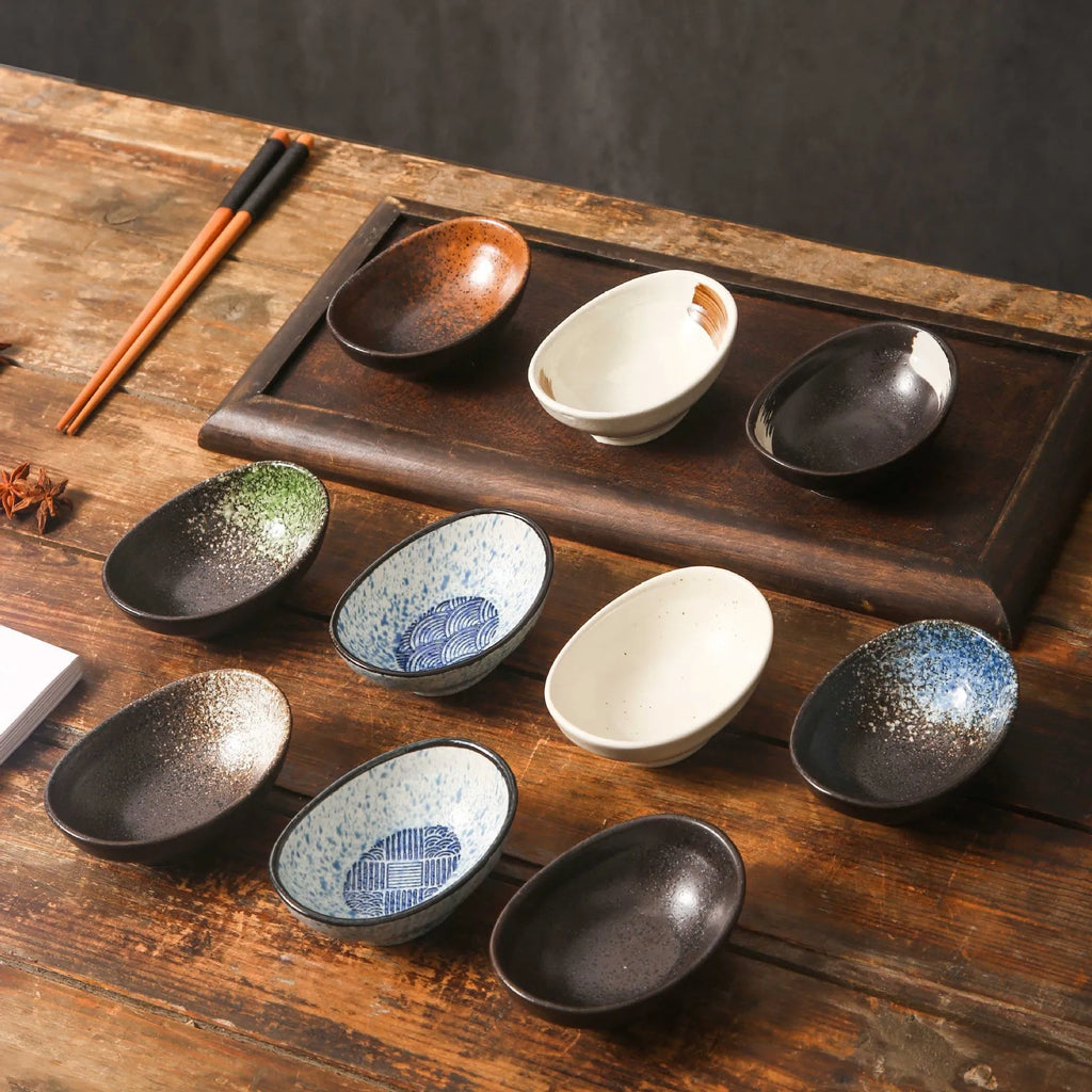 Oval Japanese ceramic sauce dipping bowl with underglaze pattern, measuring 9cm x 6cm x 4cm