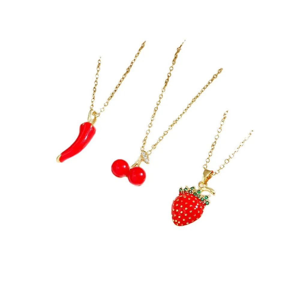 Titanium steel necklace with O-ring chain and delicate fruit pendant in golden cherry finish