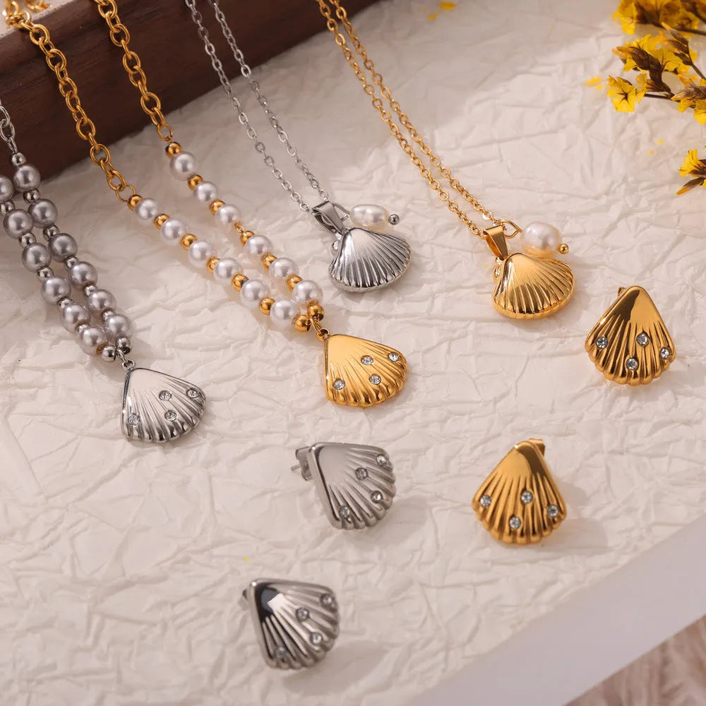 French vintage shell pendant necklace with titanium steel chain and freshwater pearl bead on gold background