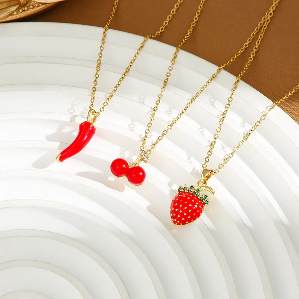 Titanium steel necklace with O-ring chain and delicate fruit pendant in golden cherry finish