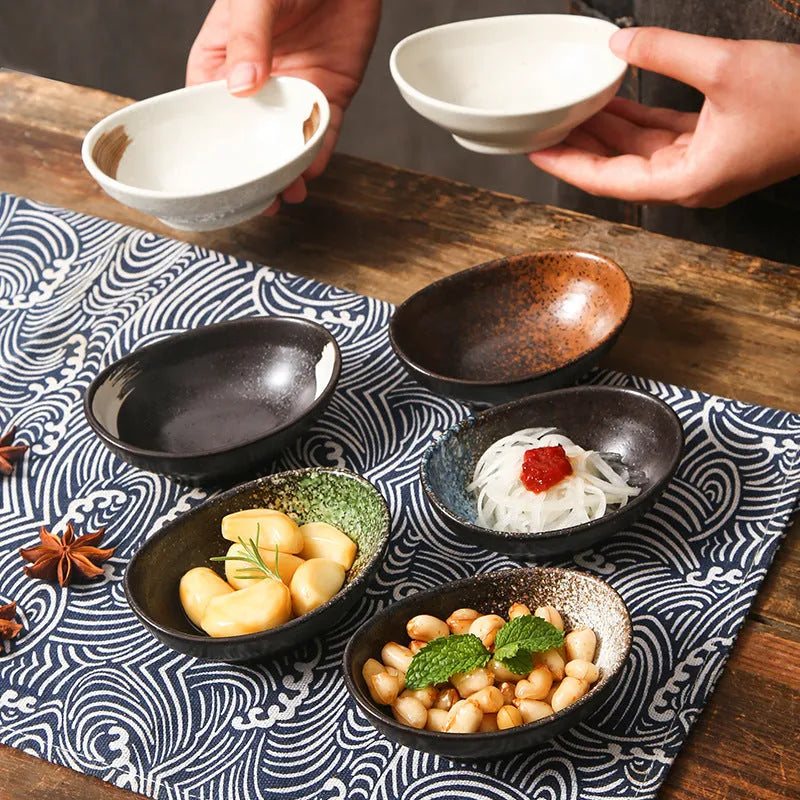 Oval Japanese ceramic sauce dipping bowl with underglaze pattern, measuring 9cm x 6cm x 4cm