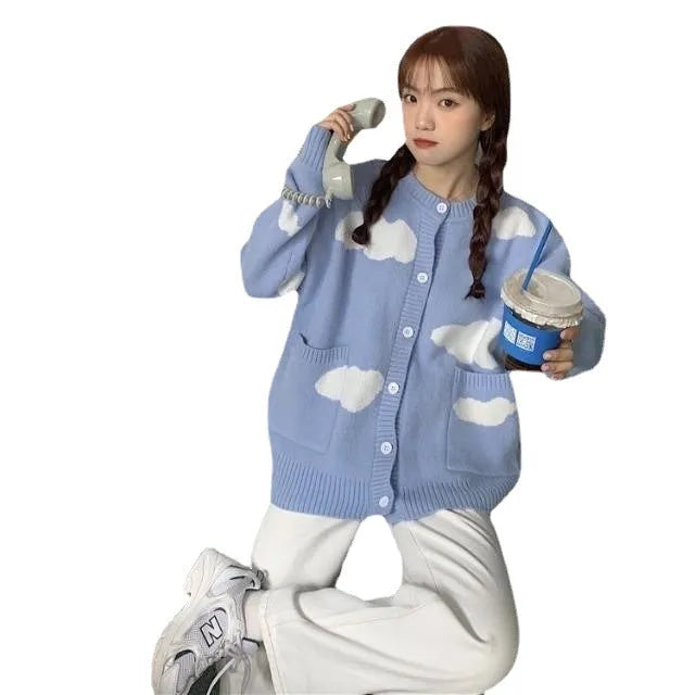 Blue loose-fit women's spandex cardigan sweater with a white cloud pattern.