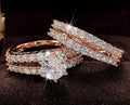 A 2 in 1 female ring set showing a geometric fashion ring and a fully-jewelled ring in gold, rose gold, or silver colour on a UK size 8 finger.