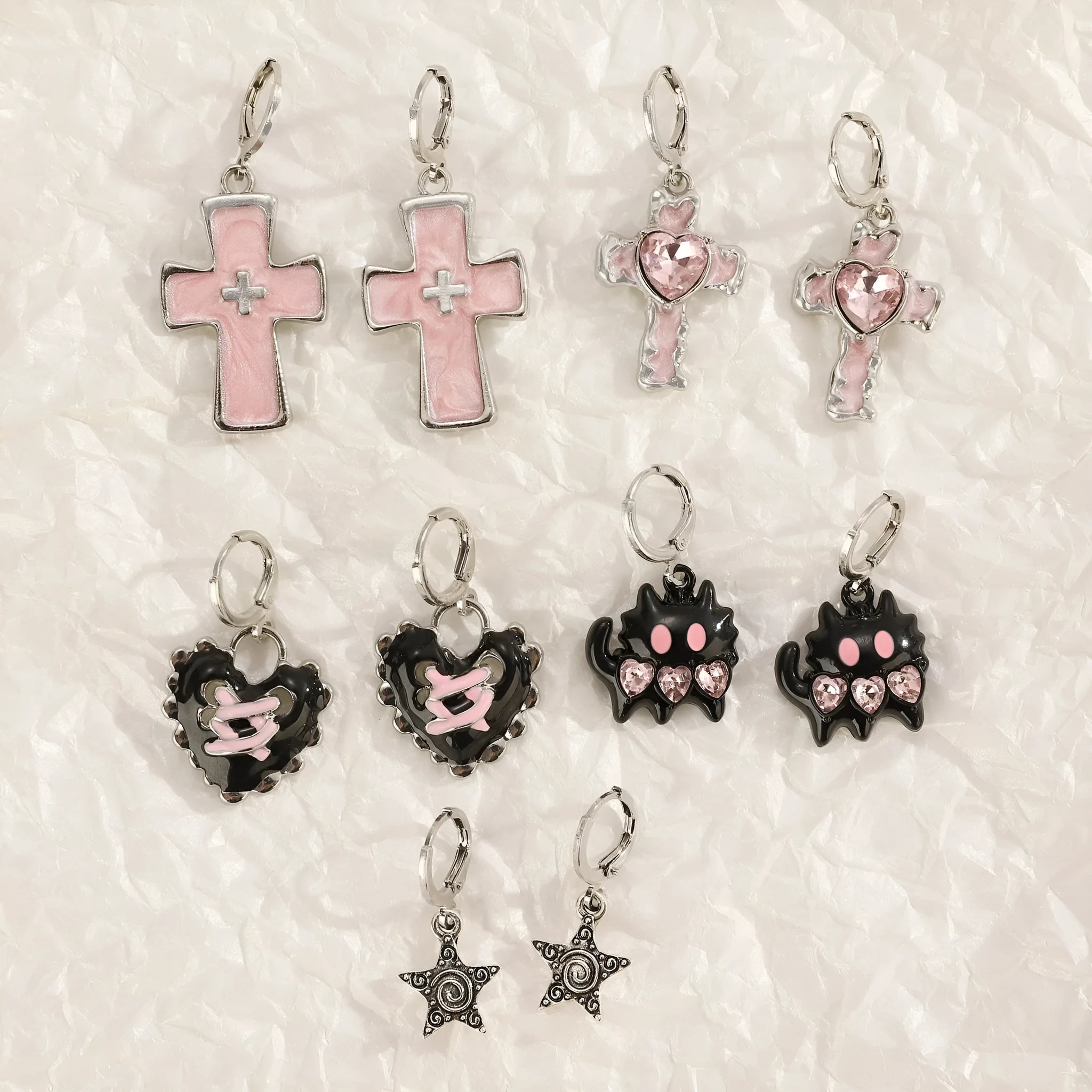 Women's alloy earrings with dripping oil treatment in five colour options showing cross and heart designs