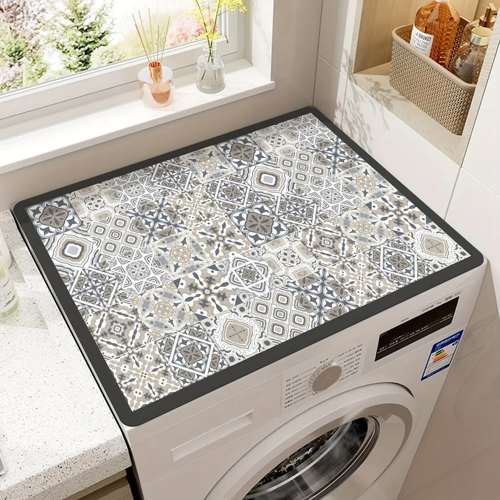 Square polyester washing machine floor mat with an abstract printed design in front of a laundry appliance.