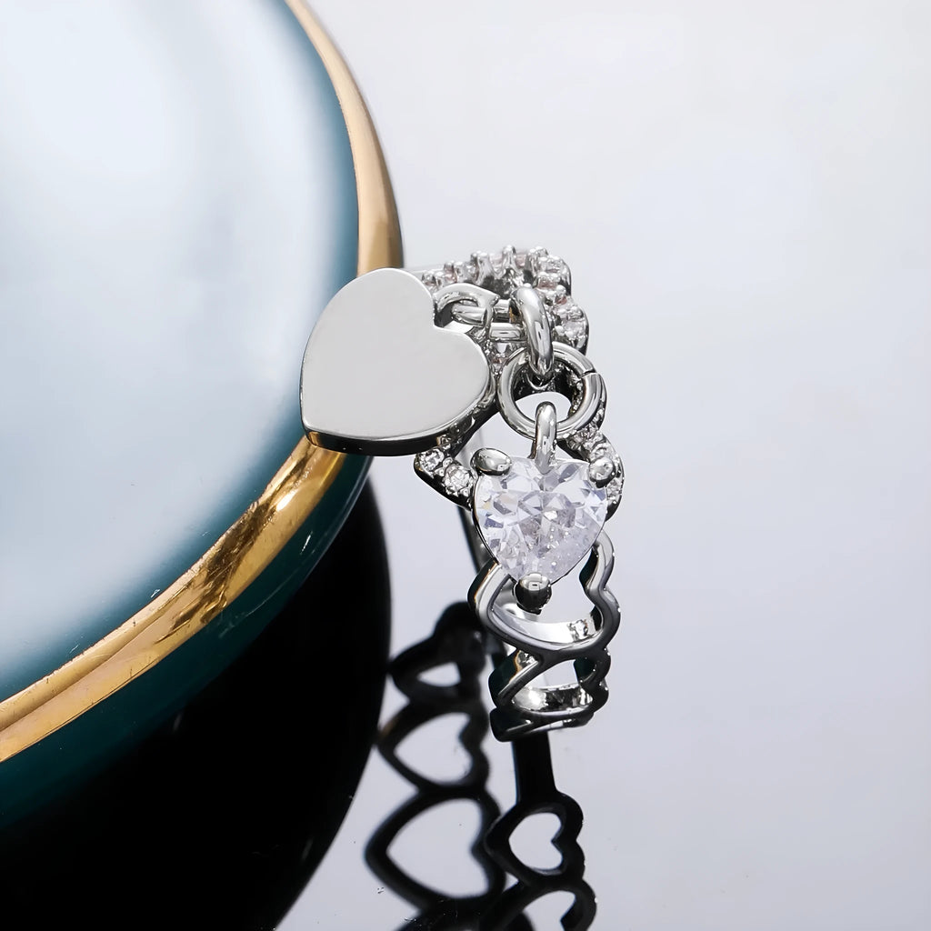 Heart-shaped open ring in white K electroplated copper with love-heart design and adjustable band