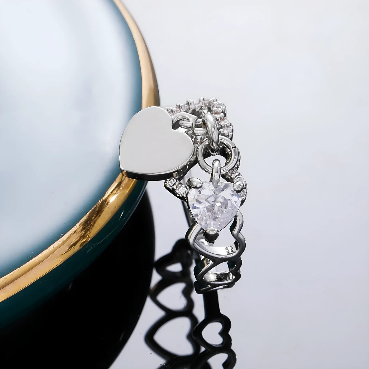 Heart-shaped open ring in white K electroplated copper with love-heart design and adjustable band