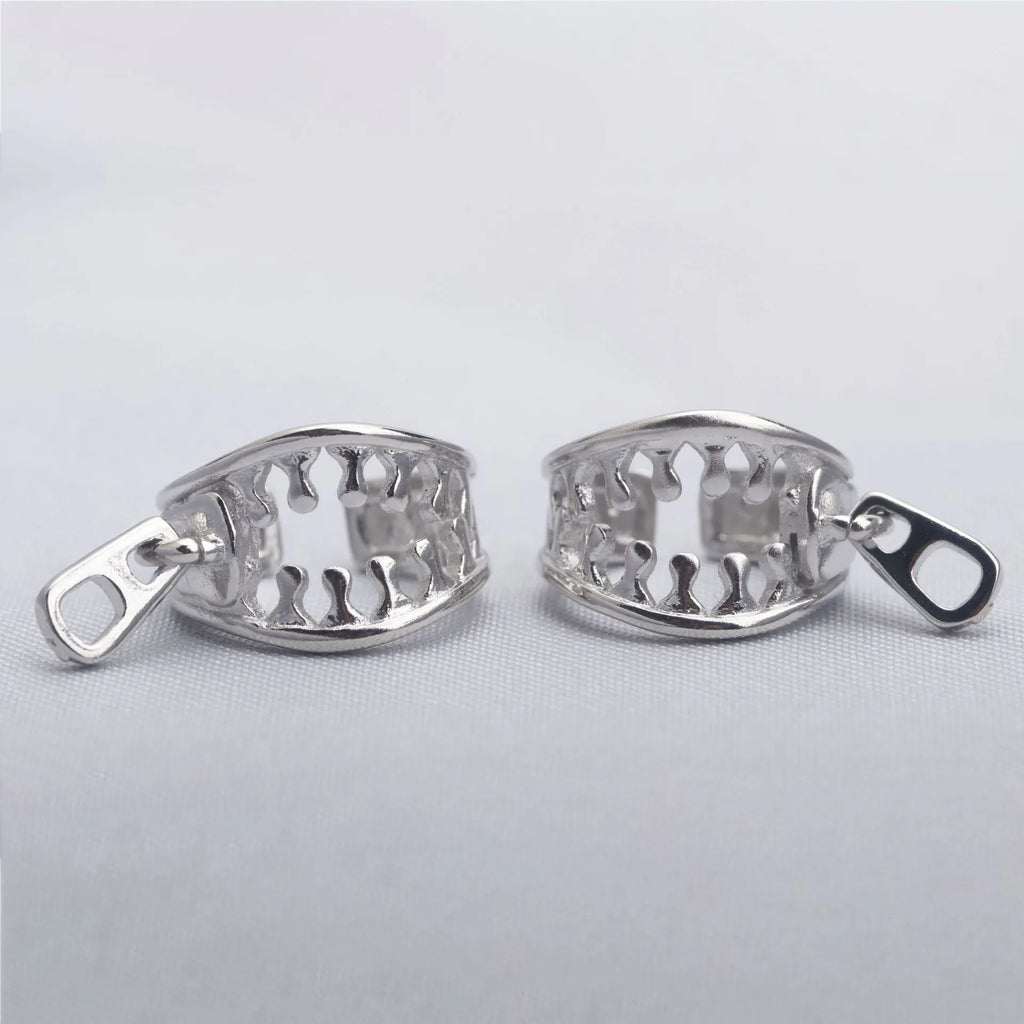 Copper geometric ear clip with zipper closure in ES862 colour, showing simple line design