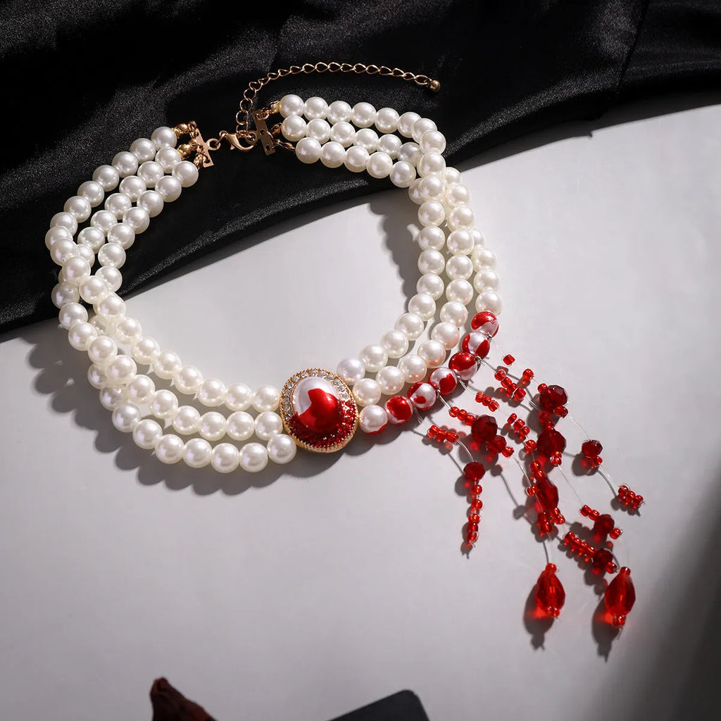 Halloween pearl collar jewellery set with gold-toned necklace, bracelet, and ear studs in retro gothic style