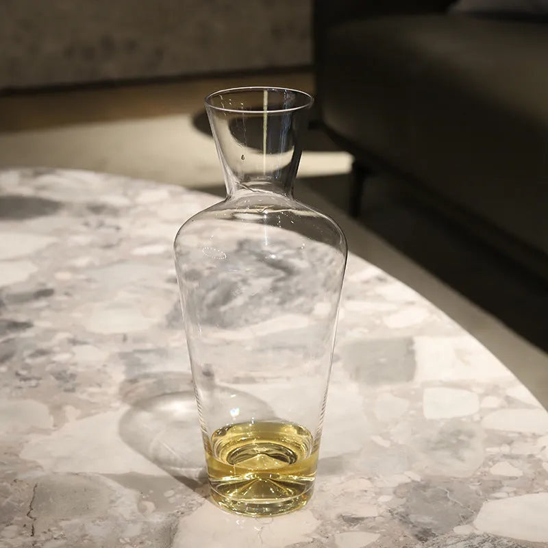 Clear glass wine decanter with removable interior divider shown on a table