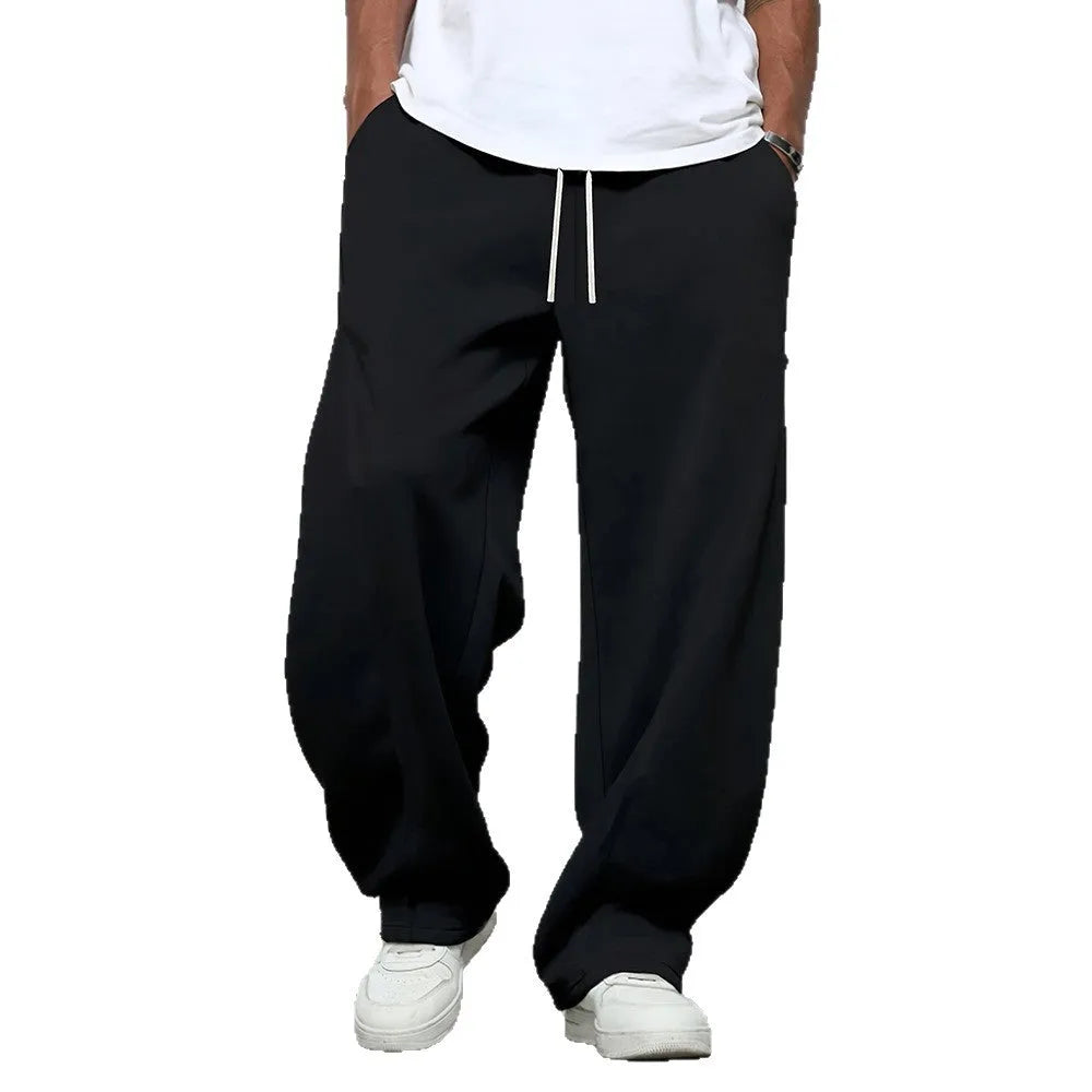 Men's straight leg casual trousers in polyester with micro-elastic waistband and drawstring closure, available in three colours.
