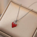 Titanium steel necklace with O-ring chain and delicate fruit pendant in golden cherry finish