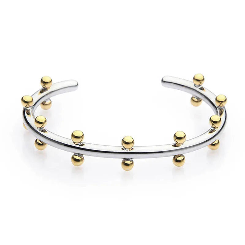 Stainless steel adjustable bracelet with C-shaped links and rivet-shaped bean beads in gold, steel, or steel gold finish