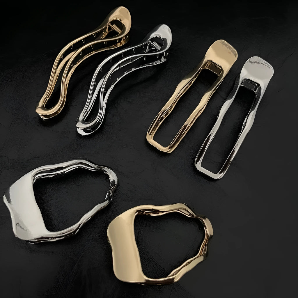 Women's zinc alloy barrettes in gold and silver colours showing arc, square, and triangle shapes