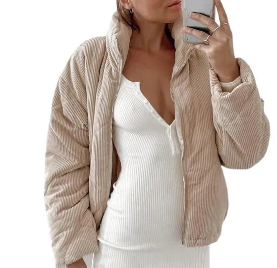 Women's apricot corduroy jacket with stand collar, long sleeves, and zipper closure, showing textured fabric and wadded design.