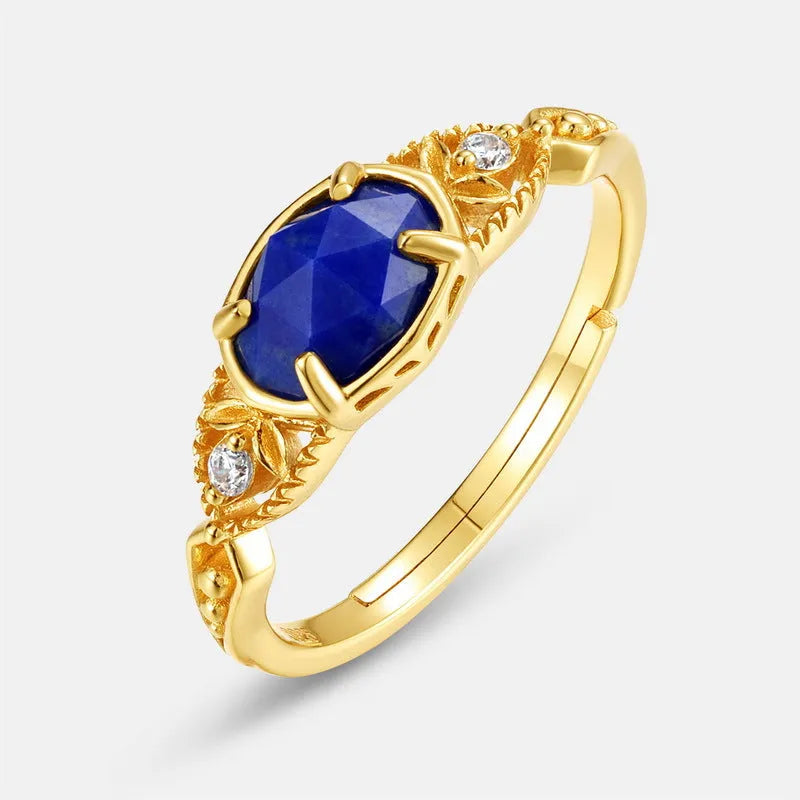 Elliptical lapis lazuli ring with sterling silver setting showing geometric design and natural stone colour variations