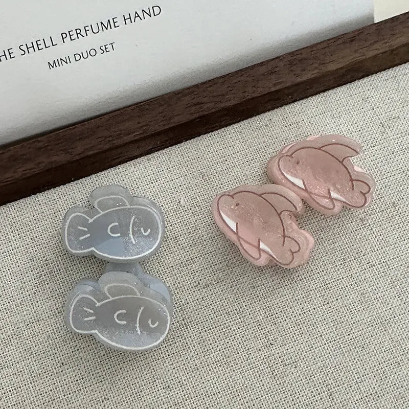 Dolphin grabber clip hair accessory for women in blue fish and pink dolphin colours, barrette style