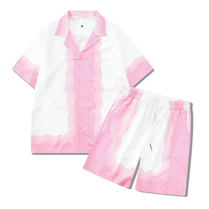 Plaid patterned short-sleeve shirt and matching trousers laid flat, a blue and white beachwear set.