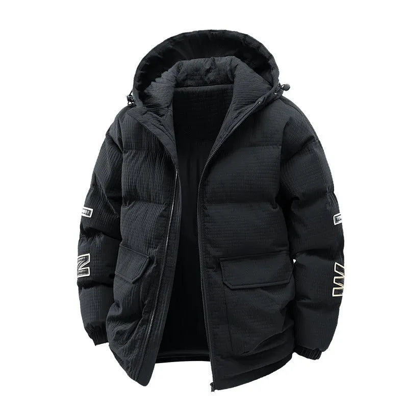 Man wearing a black Korean-style hooded cotton-padded winter coat with side pockets.