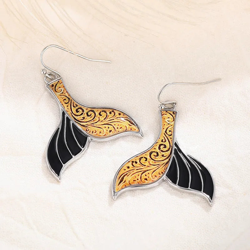 Women's fishtail design earrings with whale motifs in white gold colour alloy