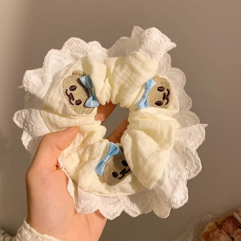 Blue cloth hair ring with bear motif and bowknot design on elastic band