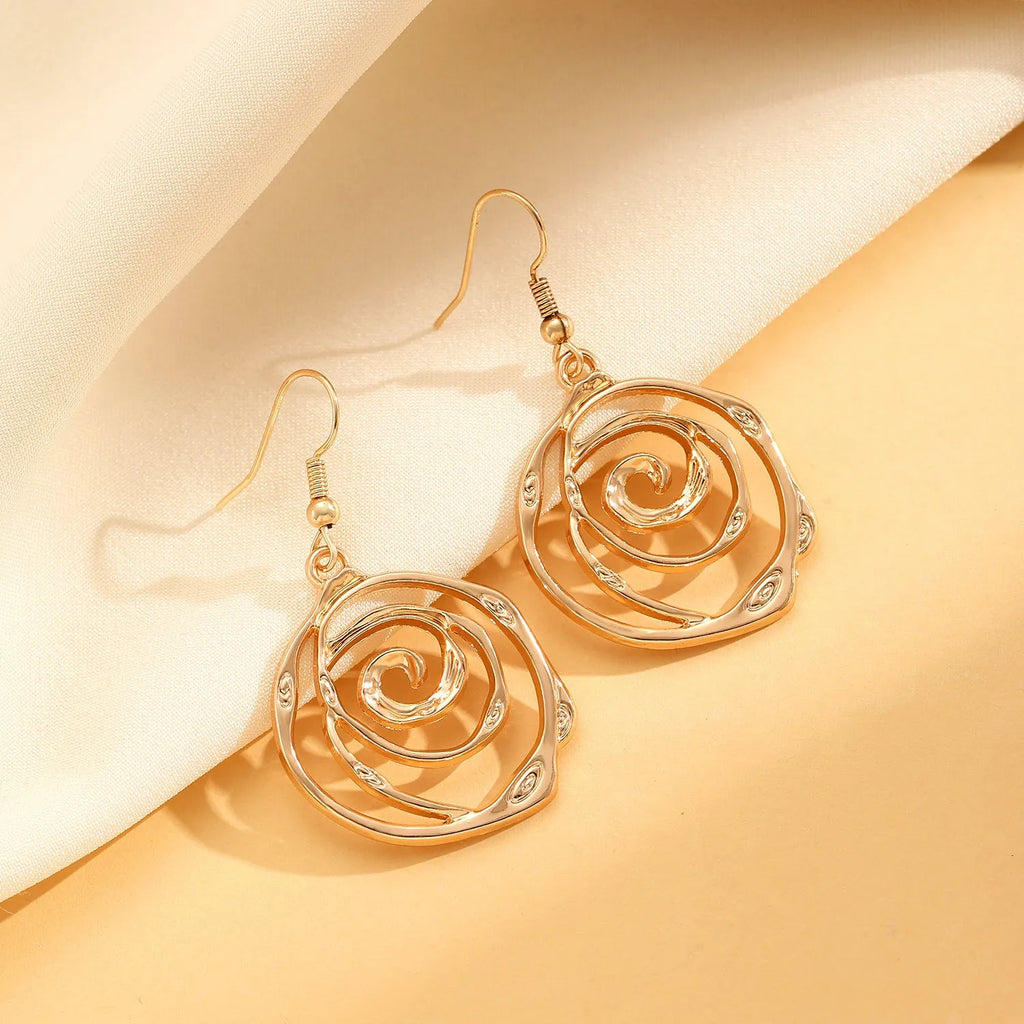 Spiral donut jewellery set with necklace, bracelet, and earrings in gold electroplated alloy