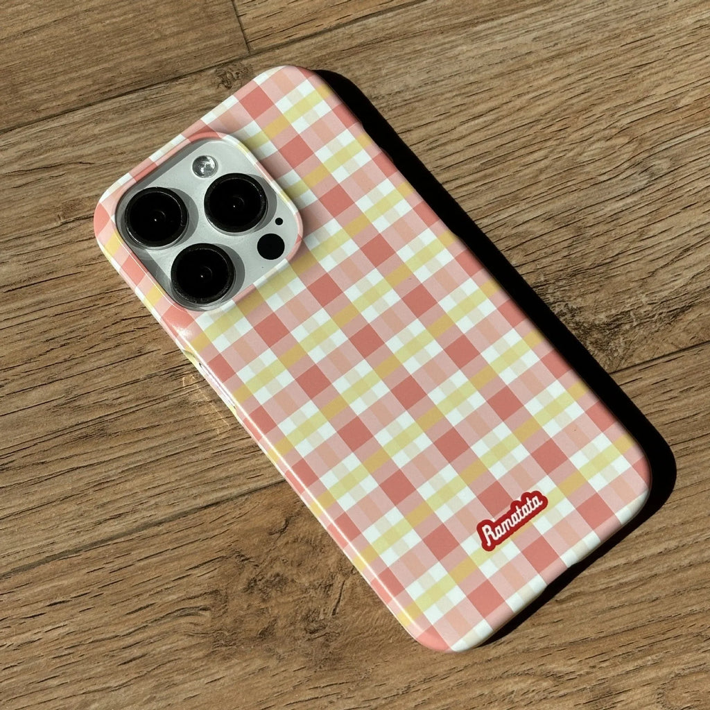 iPhone 15 Pro Max case with red and orange plaid pattern in glossy and frosted finishes