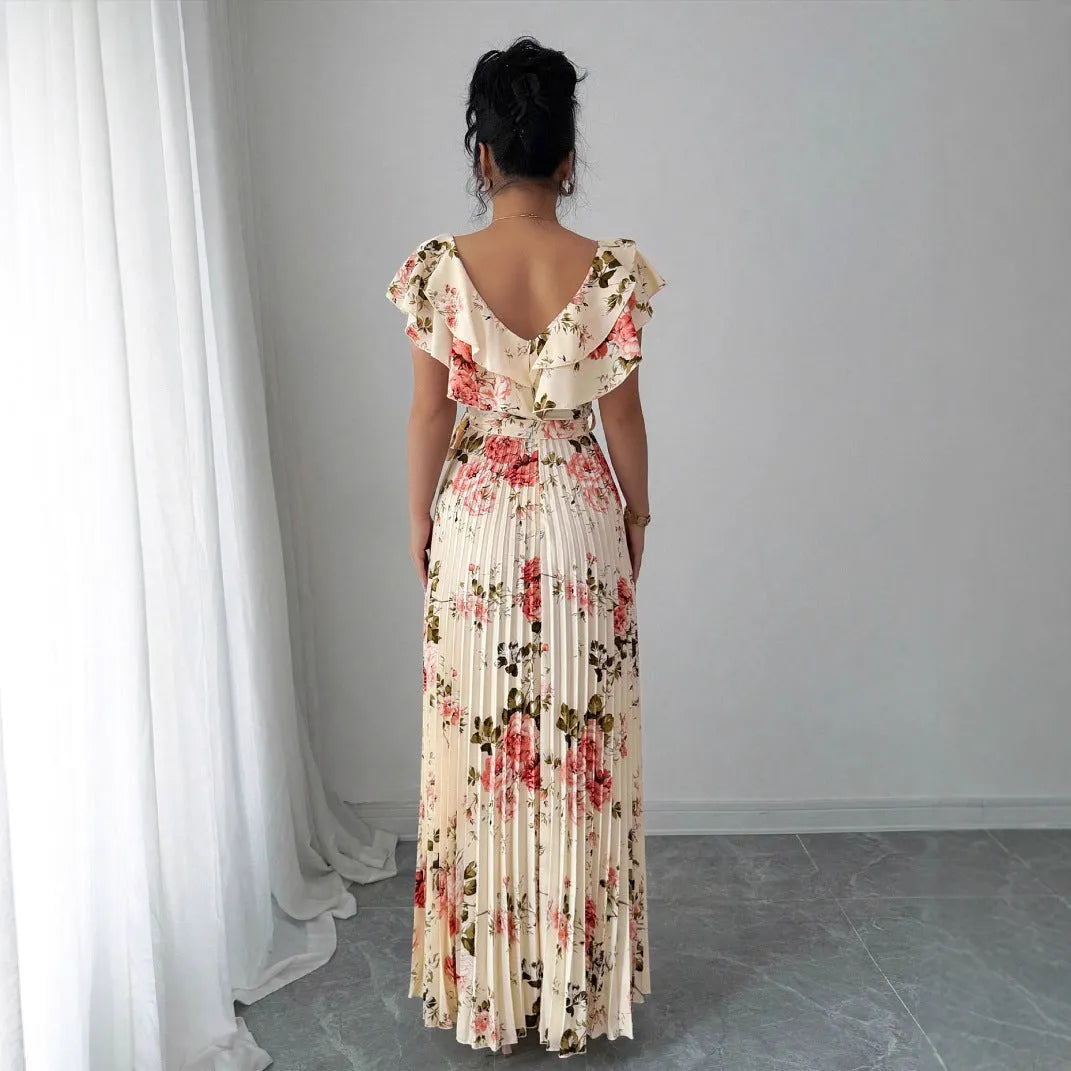 V-neck floral print dress with oversized swing skirt and ruffled sleeves in apricot colour, showing high waist and pleated details