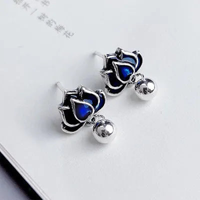 Blue lotus earrings with retro artistic seedpod tassel design, 1.2cm wide alloy studs with silver needle fastening