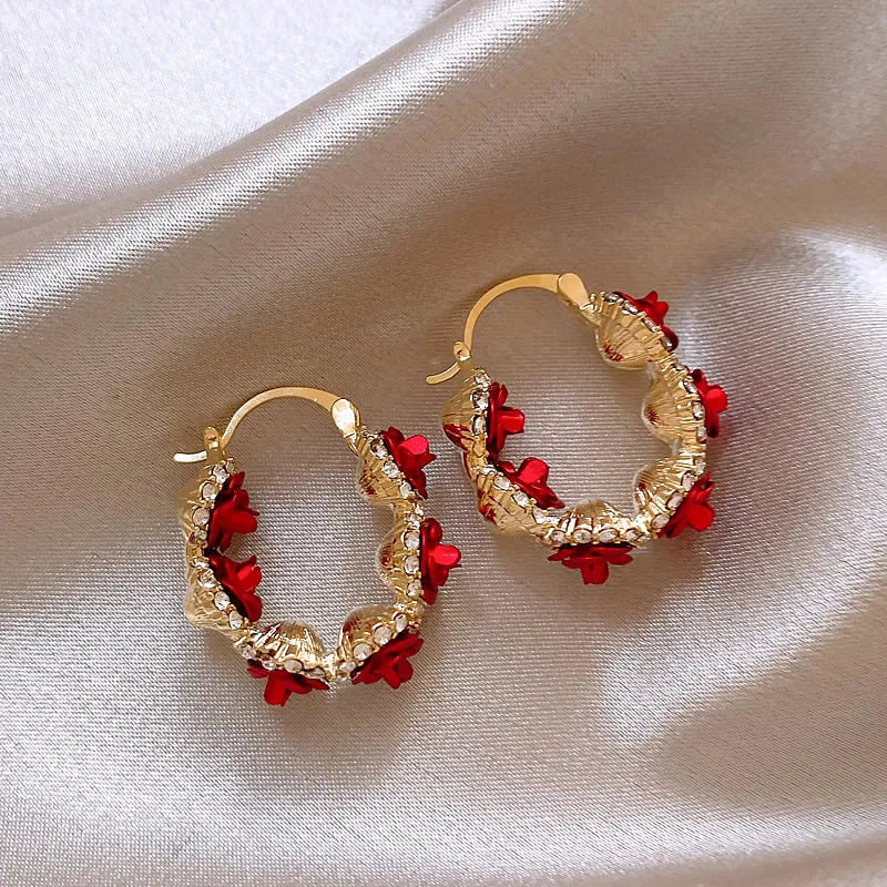 Red floral alloy clip-on earrings with rose detail for women