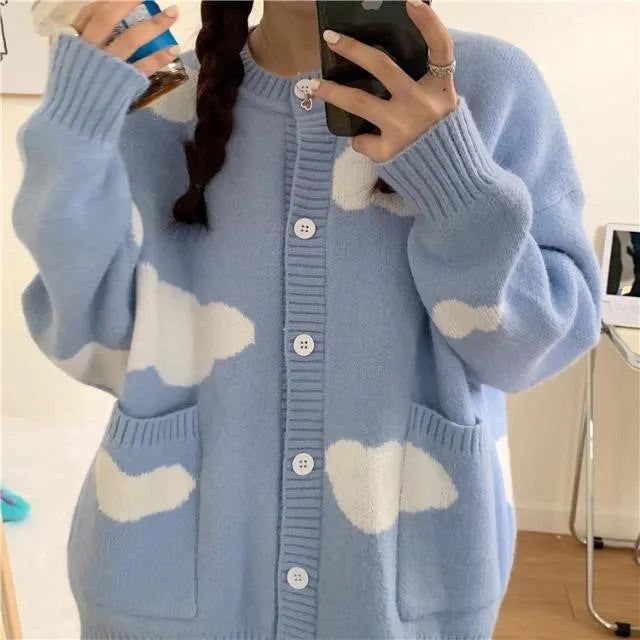 Blue loose-fit women's spandex cardigan sweater with a white cloud pattern.