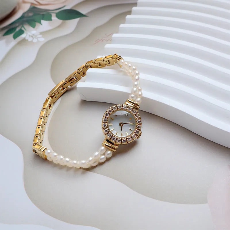 Women's light gold bracelet watch with freshwater pearls, 18mm round dial, stainless steel strap
