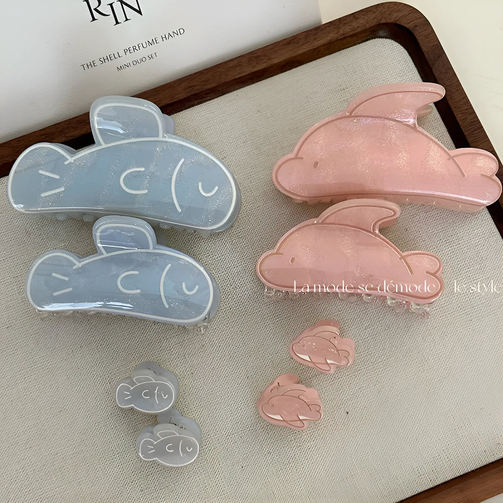Dolphin grabber clip hair accessory for women in blue fish and pink dolphin colours, barrette style