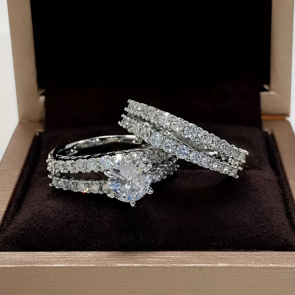 A 2 in 1 female ring set showing a geometric fashion ring and a fully-jewelled ring in gold, rose gold, or silver colour on a UK size 8 finger.