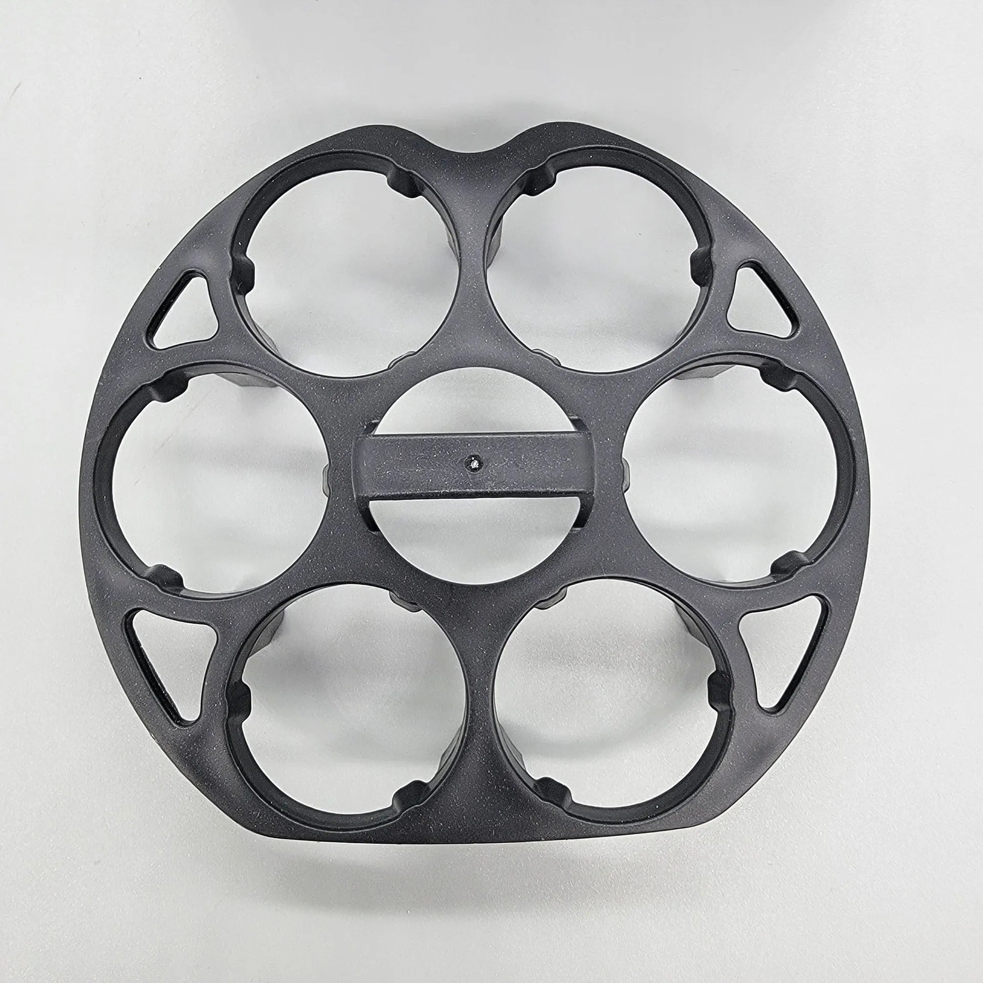 Black plastic egg holder measuring 13.8×12.6×5.7cm with retainer compartments for secure egg storage