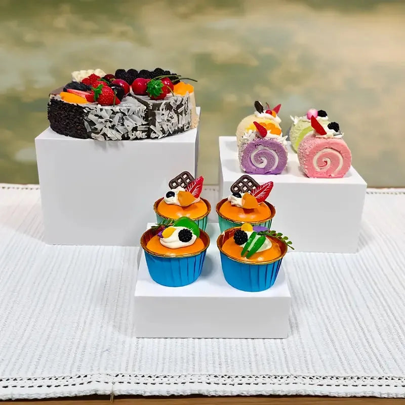 White modular cube dessert display stand with 6 pieces arranged in tiered configuration