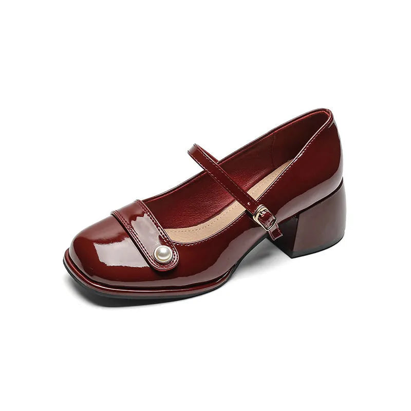 French-style women's chunky heel pumps with buckle fastening, square toe, in patent leather with rubber sole.