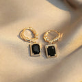 Geometric copper earrings with black zircon accents in quadrilateral design