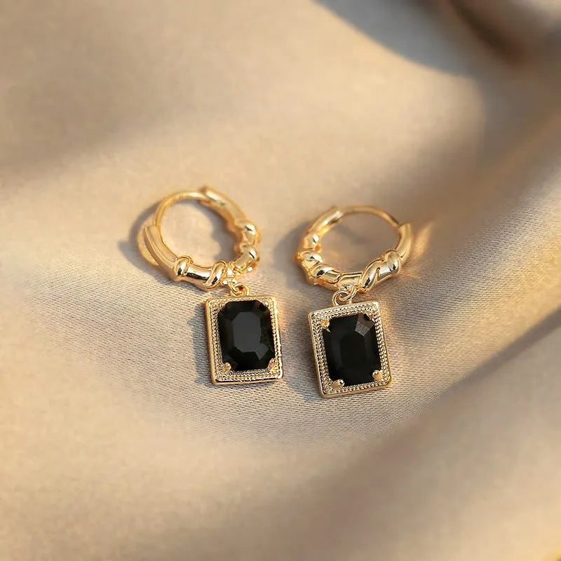 Geometric copper earrings with black zircon accents in quadrilateral design