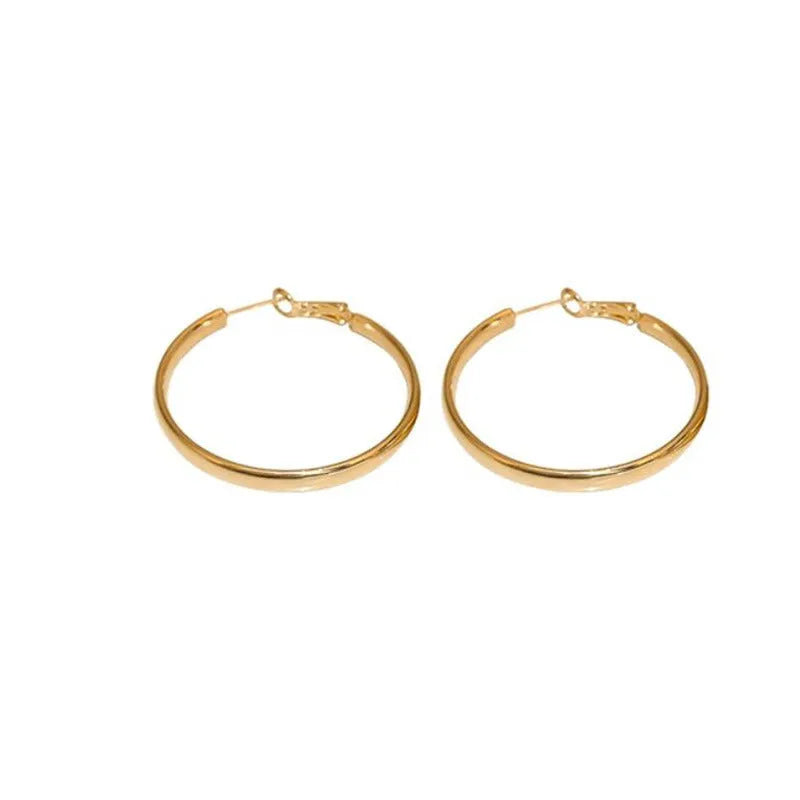 Pair of 40mm diameter circle earrings with electroplated gold or silver finish on copper