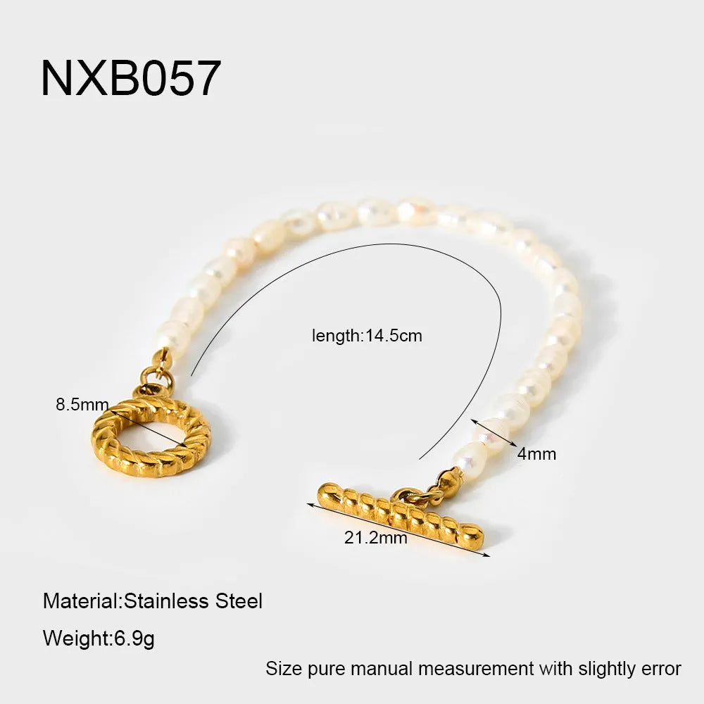 Freshwater pearl and stainless steel geometric pendant necklace and matching bracelet set for women.