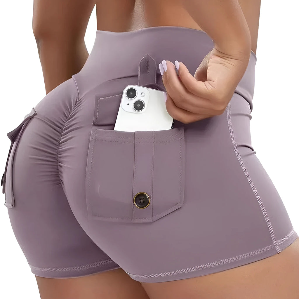 Women's hip tight fitting nylon-blend workout shorts in grey, shown on a model.