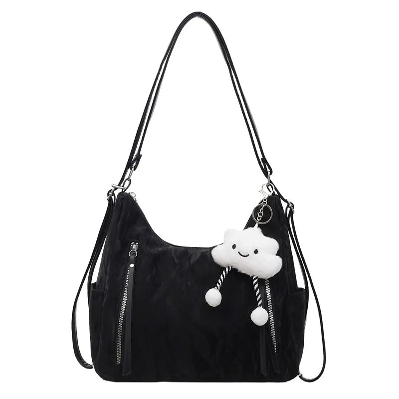 Women's soft PU fashion backpack in four colours with wear-resistant construction and included pendant accessory