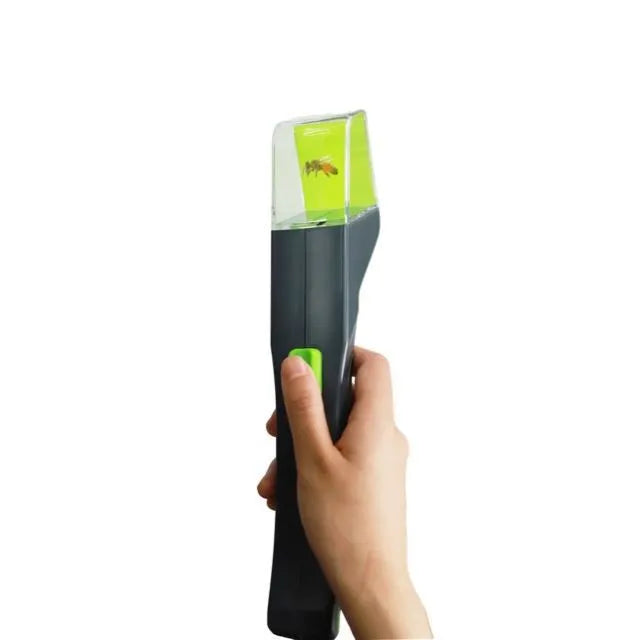 Green plastic handheld insect catcher measuring 30cm length for garden pest control