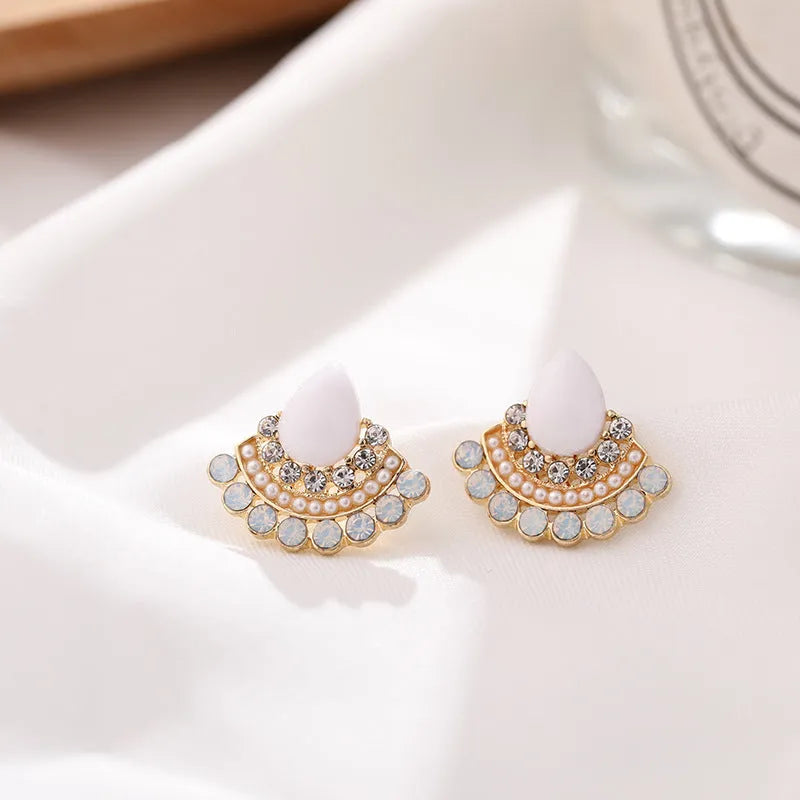 Women's silver geometric fan-shaped earrings with rhinestone and opal detailing on alloy base
